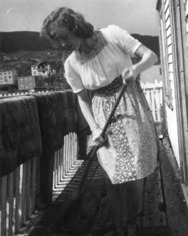 018: Anne McCarthy sweeping mats on the family porch. (circa 1942)- daughter of James McCarthy &amp;amp; Julia Reddy